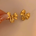 Elegant gold bow-shaped earrings with fine brushed metal texture for a vintage look - Gold Bowknot Style (KD2591)