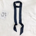 Detail of a 2-meter navy blue silk scarf on a white textured fabric with an art card - 190*5cm / Navy Blue