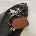 Brown litchi grain shoulder bag with red heart pattern and geometric woven strap - Brown