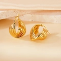 Macro shot of 18K gold-plated ribbed hoop earrings with a modern layered twist design - 25mm (PJER301) / Gold