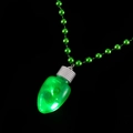 Macro detail of a glowing green bulb pendant necklace on a bead chain for Christmas - Green Bulb Bead Necklace