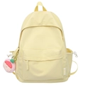 Minimalist light yellow large capacity backpack with cartoon pendant for students - Yellow
