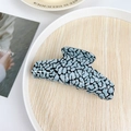 Blue and black leopard print acetate hair claw clip on a white wooden tray - 11cm / Teal Spots