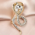 Golden cobra snake brooch with clear teardrop gemstone on pink silk background - Style 03 Gold