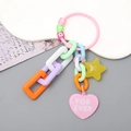 Colorful acrylic keychain with candy colored chains, star pendant and heart charm - Pink