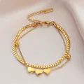 Double-layer gold titanium steel bracelet with polished heart charms on silk background - Gold Heart Double Layer Bracelet (5181)