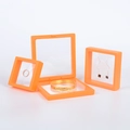 Three orange PE film suspension jewelry display boxes for rings and bracelets - 70*70*20mm / Orange