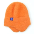 Close-up of bright orange fuzzy knit beanie with earflaps and blue snowflake patch - Orange