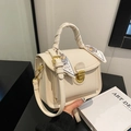 White pebbled leather shoulder bag with matching silk scarf and gold hardware accents - White