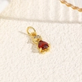 Macro shot of 18k gold plated turtle pendant with red heart stone and zircon head detail - Red (Humanoid Style)