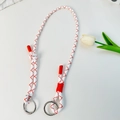 Red and white braided strap with silver metal rings on a minimalist white background - Universal Strap / White Orange Striped