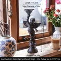 Vintage bronzen gietijzeren engel kandelaar met opgeheven plateau voor tafeldecoratie - Gietijzeren Engelhouder - Rechterhand 3073R