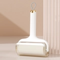 Portable ivory white lint roller with golden metal trim and protective dust cover - White