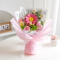 Beautiful hand-knitted crochet flower bouquet in pink gift wrapping for Mother's Day gifting - Gerbera Pink