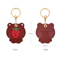 Brown bear leather keychain case with red strawberry and golden ring, front and back view - Strawberry Bear
