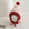 Detail of baby knit elf hat with pom-pom and adjustable red chin ties in pink and red - 6-24 Months / Pink