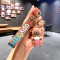 Capybara keychain with brown strap featuring a cute 3D figurine holding a pink drink cup - B228-4 Milk Tea