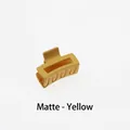 Close-up of a matte yellow hollow rectangular hair claw clip with a frosted texture - Matte-Yellow