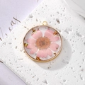 Handmade gold pendant with pink daisy flower, resin and gold foil on white stone base - Pink Daisy With Gold Foil