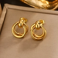 Detailed macro shot of vintage tiered golden U-shaped hoop earrings in luxury gift box - Gold Multi-ring (E-358)