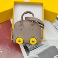 Miniature gray lychee leather car-shaped bag charm with yellow wheels in gift box - Dark Gray