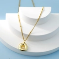 Elegant gold bubble letter necklace with a round donut pendant on a delicate beaded chain - Letter O(O)
