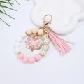 Detail of beaded silicone wristlet keychain with MAMA heart charm and leather tassel - Pink Leopard MAMA