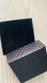 Close-up of a black faux leather jewelry box with diamond texture and velvet slots - 7x7x3 Medium Black