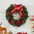 Detailed Christmas wreath featuring wooden deer, red baubles, and pine cones on a green base - Style K Wreath