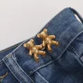 Matte gold bear-shaped waist adjuster buckle set on blue denim jeans for tightening - Small / Matte Gold