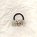 Black elastic hair tie featuring a minimalist silver-tone crinkled alloy metal detail - Silver Irregular Liquid 5cm