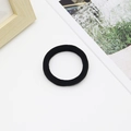 Close-up of seamless black elastic hair ties with woven texture on a white surface - 5cm Black (1.2g)