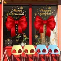 Red Christmas bow window stickers with golden Merry Christmas and snowflake patterns - Model AMJ960