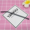 Gray heat-resistant borosilicate glass bent drinking straw on a pink checkered background - 8*200mm / Starry Grey Bent