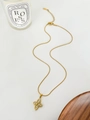 Macro shot of 18K gold clover necklace with zircon inlay and elegant snake chain details - Zirconia Flower Necklace