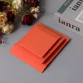 Three sizes of orange PE membrane suspension boxes for jewelry display and storage - Orange Cardboard Sleeve / Round Base
