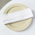 Detail of white ribbed knit headband texture on a decorative cream ceramic tray - White