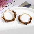 Detail of bohemian gold hoop earring with natural brown tiger eye stones in tray - Tiger's Eye / Brown