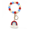 Silicone bead keychain bracelet with red, blue, and beige rainbow tassel charm - Red
