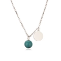 Close-up of a silver stainless steel necklace with turquoise bead and round coin pendant - Steel Phoenix Stone