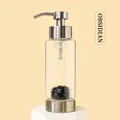 Soap dispenser with obsidian crystals in a transparent glass bottle and metal pump - Obsidian
