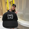 Close-up of a black washed cotton baseball cap with white Dog Dad embroidery detail. - Adjustable / Black