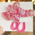 Detail of pink hair ties with resin butterfly charms and glitter inside for girls - Rose Red