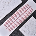 Detail of pink French press-on nails with 3D floral accents and golden beads on a rack - Wy-008 / 10 Pieces In Xs Size