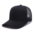 Detail of breathable black mesh trucker hat showing high-quality stitching and cotton fabric - Adjustable / Black