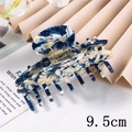 Detail view of 9.5cm acetate hair claw clip with blue and white marble pattern - 9.5CM / Blue and White Ink Splatter