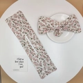 Macro view of floral print hair bun maker set with elegant pink and green patterns - Little Floral