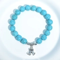 Turquoise beaded bracelet with cracked pattern and silver double bell pendant charms - Blue Turquoise Double Bells Charm