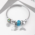 Silver bead bracelet with dolphin, fish tail, and light blue crystal charms - C1-016 Blue