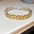 Close-up of double-row yellow pear-cut zircon bracelet with silver sparkling finish - Yellow